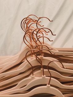 there are many metal sculptures on the bed sheeted sheets that have been folded together