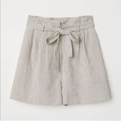 Reposhing This Item I Purchased From @Kaitlintran. They Were Too Small For Me. Short Shorts In Textured-Weave, Cotton Blend Fabric. Elastic Waistband, Pleats At The Top, And Removable Tie Belt. Fly With Concealed Zipper And Button, Side Pockets. Small Tear On The Back Right. Questions? Leave A Comment Below! Beige Summer Shorts For Work, Beige Paperbag Waist Shorts For Workwear, Chic Beige H&m Bottoms, H&m High Waist Beige Bottoms, Beige Summer Bottoms With Paperbag Waist, Beige Paperbag Waist Summer Bottoms, Chic High Waist Shorts By H&m, Summer Beige Paperbag Waist Bottoms, H&m Beige Spring Bottoms