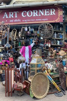 a store front with lots of antiques on display