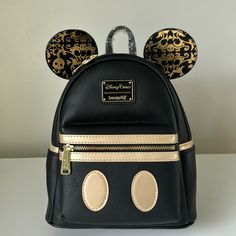 New With Tags. Part Of The Limited Release Mickey Mouse The Main Attraction Series. Subtle Art, Black Bag With Gold Trim. Small Discolorations On The Gold Art Of Ears. Black Mickey Mouse Backpack, Disney Style Backpack With Zipper Closure, Black Disney Backpack For Travel, Disney Leather School Backpack, Disney Leather Backpack For School, Disney Black School Bags, Disney Style Black School Bags, Black Mickey Mouse Backpack For Daily Use, Disney Leather Backpack For Disney Trips