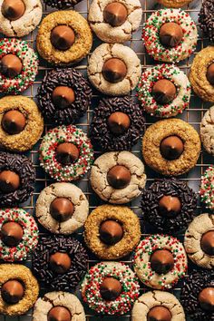 chocolate covered cookies and sprinkles are on a cooling rack, ready to be eaten