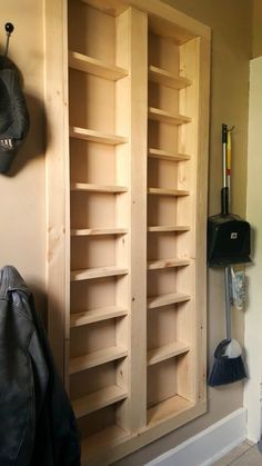 a coat rack made out of wooden shelves