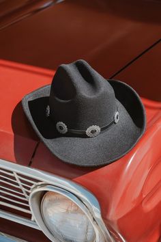 Show up to any festival this season like a total cowgirl cutie with the Lulus Wild West Wonder Black Conch Cowboy Hat! This rodeo-ready hat has a sturdy felt construction that shapes a dramatic flipped-up brim and a classic pinched top. A matching, smooth faux leather band features silver metal conch embellishments that complete the Western-style look! 3. 25" soft brim. 25" interior circumference with internal drawstring. Crown measures 4. 25" tall. 90% Polyester, 10% Alloy. Imported. Lulus | Wild West Wonder Black Conch Cowboy Hat. Western Black Hat For Western-themed Events, Western Style Black Hat For Western-themed Events, Adjustable Western Felt Hat For Western-themed Events, Black Country Style Felt Hat For Rodeo, Country Style Black Felt Hat For Rodeo, Western-style Adjustable Felt Hat For Country Events, Western Style Adjustable Felt Hat For Country Events, Western Style Short Brim Felt Hat For Festivals, Adjustable Felt Fedora For Rodeo