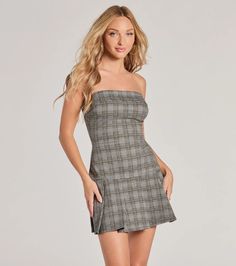 Embrace the new season in this plaid mini dress featuring a strapless neckline, form-hugging silhouette, and a flirty pleated mini-length hem. Perfect for back-to-school and styling with flats.Fit & FeaturesPlaid pattern, knit fabric, moderate stretchStrapless folded necklineForm-hugging silhouettePleated mini-length hemRuns true to size Strapless Fitted Mini Dress For Fall, Plaid Fitted Mini Dress For Party, Trendy Fitted Plaid Mini Dress, Trendy Fitted Pleated Mini Dress, Trendy Mini Length Plaid Dress, Sleeveless Plaid Mini Dress For Date Night, Plaid Sleeveless Mini Dress For Date Night, Fitted Plaid Mini Dress For Date Night, Trendy Plaid Mini Dress For Party