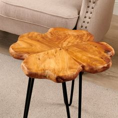 a wooden table sitting on top of a carpeted floor