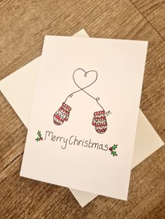 two christmas cards with mittens on them