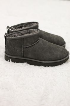 Our "UGG Classic Ultra Mini (Grey)" has a lower shaft height, adding easy on-off and enhanced versatility. Featuring everything you love about the original like signature UGG sheepskin and a flexible, lightweight sole, it pairs with virtually anything – the styling options are endless. Ugg Ultra Mini Grey, Grey Ultra Mini Uggs, Ugg Mini Grey, Ugg Classic Ultra Mini Boots, Ultra Mini Ugg Colours, Grey Mini Uggs, Ugg Classic Mini Grey, Grey Ultra Mini Ugg Boots, Ugg Grey