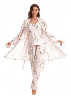 egance and comfort combine in this exquisite three-piece sleepwear set. The set includes a long, flowing robe, a sleeveless top, and matching pants, all adorned with a delicate floral print. Crafted from a soft, breathable fabric, each piece promises to keep you cool and comfortable throughout the night. The robe features a tie waist, allowing you to adjust for a perfect fit and providing an added layer of warmth when needed. The sleeveless top offers a relaxed fit with a touch of femininity, th Feminine Floral Print Loungewear Sleepwear, Feminine Floral Print Loungewear Nightgown, Feminine Floral Print Nightgown For Loungewear, Feminine Floral Print Sleepwear For Lounging, Feminine Floral Print Sleepwear For Wedding Night, Feminine Floral Print Pajama Party Sets, Pajamas Sets, Women's Pajamas, Sweater Trends