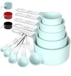 there are many measuring cups and spoons on the table