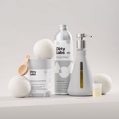 three different types of beauty products on a white surface, including soap and lotion