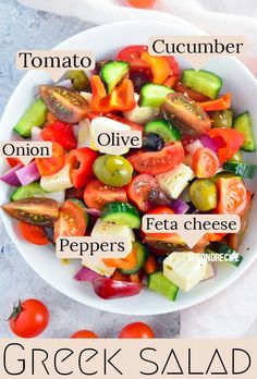 greek salad with tomatoes, cucumber, onion, olives, peppers, and feta cheese