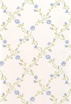 a white wall with blue flowers on it