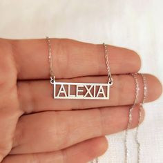 "Framed Name Necklace, Custom Nameplate Necklace, Dainty Name Necklace, Silver Name Necklace, Birthday Gift To Wife Girlfriend Sister Mother, P E R S O N A L I Z E D ∙ J E W E L R Y ❤ Handmade with love ❤ 🧿 Welcome to GDjeweltr. All our jewelery is made by handmade in our workshop as custom. The most unique gift you can find for you and your loved ones ♥ Please take a look my store to see our handmade necklaces, rings, earrings and bracelets collection. ⭐ Item Details: * Material: 14K Solid Gold * Finish: 14K Yellow Gold, 14K White Gold, 14K Rose Gold. * Material: High Quality Solid 925 Sterling Silver * Finish: Silver, Gold, Rose Gold. * Initial height: 9 mm * Chain width: 0.85 mm ✅ Making Process : All of our jewelry are handmade, carefully handcrafted and made to order. All of our prod Silver Name Necklace, Name Necklace Silver, Bracelets Collection, Nameplate Necklace, Gold Initial, Name Necklaces, Bracelet Collection, Necklace Dainty, Name Plate