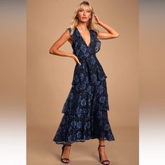 Lulus Exclusive! Take A Twirl And Turn Some Heads In The Lulus Molinetto Navy Blue Lace Ruffled Tiered Sleeveless Maxi Dress! Lovely Floral Lace, Over A Contrasting Black Woven Lining, Falls From A Plunging V-Neckline, Into A Ruffled Sleeveless Bodice. High, Fitted Waist Sits Above An Elegant Tiered Maxi Skirt. Hidden Back Zipper/Clasp. Fully Lined. Shell: 70% Cotton, 30% Nylon. Lining: 96% Polyester, 4% Spandex. Hand Wash Cold. Do Not Bleach. Line Dry. Iron Low Heat Imported. Style 848002 Fit: Taupe Maxi Dress, Blue Lace Midi Dress, Lulus Maxi Dress, Navy Blue Maxi Dress, Lulus Dresses, Tiered Maxi Skirt, Wedding Guest Dresses, Backless Maxi Dresses, Floral Print Maxi Dress