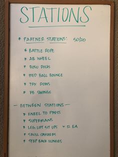 a white board with green writing on it that has instructions for station's written on it