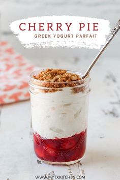 cherry pie greek yogurt parfait in a glass jar with a spoon