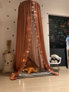 a child's play tent with lights on it