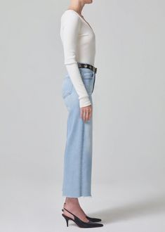 Our Lyra is a vintage inspired silhouette that sits high on the waist with an easy, relaxed top block cut with a cropped inseam with a voluminous wide leg. This fit is true to size. Looks Like: Light indigo with subtle whiskering and fadingFeels Like: Signature soft stretch denim designed to hold its shape all-day From our HUMANITY Collection Casual Cropped Wide Leg Pants For Fall, Frayed Hem Cropped Wide Leg Pants For Fall, Cropped Wide Leg Pants With Frayed Hem For Fall, Chic High Rise Wide Leg Pants For Fall, High Waist Wide Leg Pants With Frayed Hem, Chic Cropped Bottoms For Spring, Chic Wide Leg Pants With Frayed Hem, Cropped Wide Leg Pants For Spring, Chic Wide Leg Pants With Frayed Hem For Spring