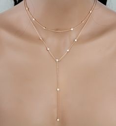 Such a pretty dainty layered necklace created with .925 sterling silver and than plated in rose gold, rhodium or 18K gold finish. Studded with tiny Swarovski Pure Brilliance stones - .925 sterling silver chain and components plated in Rose gold, yellow gold or rhodium. - Swarovski Pure Brilliance stones - Choker portion measures 13 inches and extends to 14 inches - Longer portion measures 20 inches and extends to 21 inches - Drop measures 4 inches - Available in rose gold, yellow gold or rhodium Minimalist Rose Gold Necklace With Double Chain, Minimalist Rose Gold Double Chain Necklace, Minimalist Rose Gold Layered Necklace With Adjustable Chain, Delicate Rose Gold Lariat Necklace With Clavicle Chain, Dainty Rose Gold Chain Necklace For Layering, Delicate Rose Gold Lariat Necklace, Delicate Rose Gold Chain Necklace For Layering, Minimalist Rose Gold Layered Clavicle Necklace, Dainty Rose Gold Layered Necklace