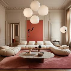 an elegant living room with white furniture and pink carpeted flooring, large chandelier hanging from the ceiling