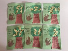 four children's handprints on green paper with words that read family tree