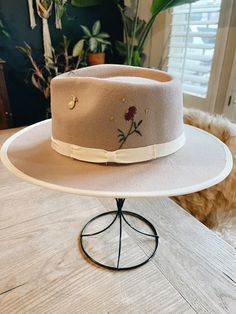 Beige Australian wool felt wide brim fedora hat. Hand embroidered and finished with a vintage hat pin. One of a kind there is a adjusting the velcro on the inside to adjust if too large. Small [6 7/8--7] size fits for 55-56cm[21 5/8 in.--22 1/4in.] head circumference; Embroidered Denim Jacket, Wide Brim Fedora, Distressed Denim Jacket, Embroidered Denim, Fedora Hat, Outfits With Hats, Hat Pins, Vintage Pins, Wide Brimmed