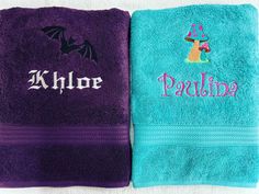 two towels with the word khloe on them, one in purple and one in blue