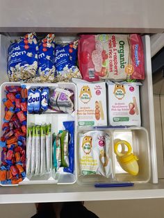 an open drawer filled with baby food and other items to eat on the night before bed