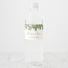 a bottle of water with leaves on it and a label that says mason & korn