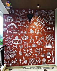 the wall is decorated with white and red designs