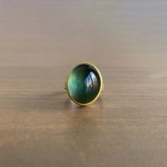 Tantalizing pine green tones ebb and flow with every turn of this mercurial tourmaline statement ring. 22k yellow gold, sterling silver Tourmaline, 18.62 carats, 15mm x 20mm (5/8" x 3/4") Jewelry Wishlist, Ebb And Flow, Light Earrings, Newport Ri, Blue Tanzanite, Wax Casting, Cabochon Ring, Nice Style, Pine Green