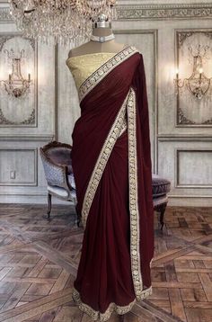 Beautiful deep maroon georgette saree with contrast beige blouse piece Gold Georgette Saree With Traditional Drape, Gold Georgette Saree For Puja, Elegant Blouse Piece With Sheer Dupatta For Puja, Gold Georgette Blouse Piece For Puja, Designer Gold Georgette Saree, Elegant Gold Georgette Saree, Bollywood Style Burgundy Dupatta In Traditional Drape, Bollywood Style Burgundy Traditional Wear With Pallu, Bollywood Style Burgundy Dupatta