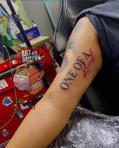 a person with a tattoo on their arm that says, art by dalivinna