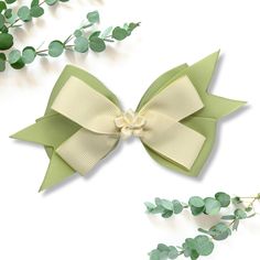 Complete your little girl's outfit with our floral green and ivory hair bow.  Each bow is handmade with grosgrain ribbon affixed with an alligator clip with an anti-slip grip. The ends are heat treated to prevent fraying. Each bow measures about 4.5 inches in length not including ribbon tail. Please note: We do our best to accurately represent the colors of our products, however please note that color of product may slightly very due to device/monitor screen settings. Lemon Merengue, Large Hair Bow, Large Hair Bows, Green Ribbon, Girl Hair Bows, Floral Hair, Girl Hair, Green Hair, Grosgrain Ribbon