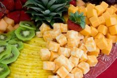 a platter filled with different types of fruits and veggies on top of each other