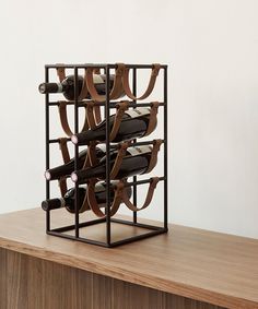 a wine rack with several bottles in it