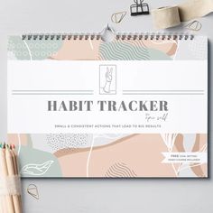 the habitt tracker book next to some pencils