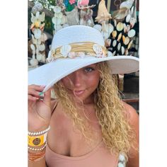 Introducing the Shell Trim Wide Brim Sun Hat - perfect for any sunny day! This fashionable hat not only provides protection from the sun's rays, but also adds a stylish touch to any outfit. With its wide brim and unique shell trim, you'll be ready for any summer adventure! * Circumference: 22 3/8" * Brim Size 3 7/8" * Crown: 3 3/4" * 80% paper, 20% polyester * UVA/UVB SPF 50 Protection Lightweight Sun Hat For Beach Vacation, Vacation Hat With Uv Protection, Beach Season Sun Hat With Uv Protection, Wide Brim Hat For Beach Season Vacation, Wide Brim Hat For Beach Vacation, Wide Brim Summer Beach Hat, Summer Wide Brim Beach Hat, Uv Protection Straw Hat For Beach Season Vacation, Upf 50+ Hats For Beach Season Vacation