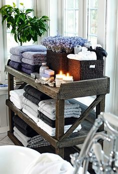 a wooden cart filled with lots of towels