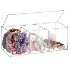 clear acrylic storage bins with decorative items in them