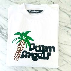 Nwot Men’s Palm Angels Classic Short Sleeve Tshirt. Never Worn. In Excellent Condition. 100% Authentic. White T-shirt With Embroidered Logo For Streetwear, White Embroidered Logo T-shirt For Streetwear, White Top With Embroidered Logo For Streetwear, Palm Tree Restaurant, Palm Angels Tshirt, Restaurant Merch, Tree Restaurant, Palm Angels, Palm Tree