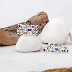 "Want the perfect stocking stuffer for Mom this year? Create a family ring with each birthstone representing someone she loves. Build the perfect family ring she will cherish forever. She will always have love wrapped around her finger! ♥♥ HOW TO ORDER ♥♥ 1. CHOOSE YOUR SIZE IN THE DROP DOWNS. 2. IN THE PERSONALIZATION BOX AT CHECKOUT PLEASE INCLUDE WHAT MONTH YOU WANT (see birthstone chart in listing thumbnail pics for colors for each month) 3. PLEASE INCLUDE YOUR PHONE NUMBER IN THE COMMENTS S Silver Multi-stone Stackable Rings As A Gift, Birthstone Rings Stackable, Mothers Rings, Gemstone Rings Unique, Stocking Stuffers For Mom, Stackable Birthstone Rings, Grandmother Jewelry, Family Ring, Birthstone Stacking Rings