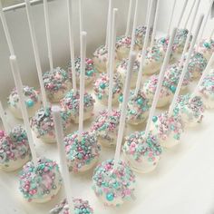 cake pops with sprinkles and white frosting