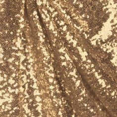 a brown and white sequin fabric