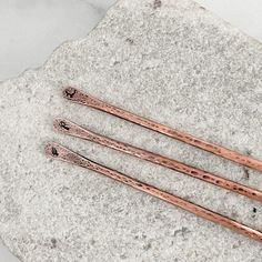 This listing is for 1 copper hair stick. If you would like more than 1 please adjustment the quantity in the drop down bar. Materials- solid 8 gauge copper wire Hand stamped with your choice of design or nothing at all. To view more of JKFoster designs click here: https://www.etsy.com/ca/shop/JKFoster?ref=l2-shopheader-name If you have any questions regarding this or another design. You can contact me via-Etsy conversation. Best Wishes! Joella Hair Pin Chopstick, Copper Hair Pin, Wood Hair Sticks, Metal Hair Sticks, Elk Horn Hair Stick, Letter Symbols, Nothing At All, Hammered Hoop Earrings, Simple Pins