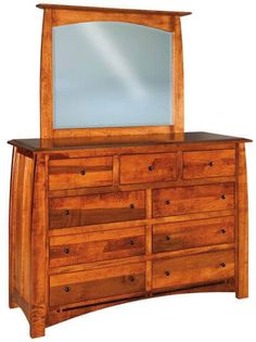 a wooden dresser with a large mirror on it's top and bottom drawer drawers