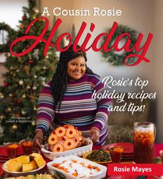 a woman standing in front of a table full of food and drinks with the words holiday written on it