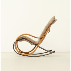 a rocking chair made out of wood and fabric with an armrest that is bent to the side