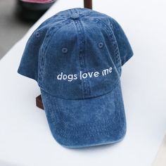 It's something to be proud of, honestly, and it's even better when everyone else knows it. With this "Dogs Love Me" hat, you're sure to be turning heads – especially those with floppy ears and four legs. Cute Hats With Embroidered Logo And Curved Brim, Cute Baseball Cap With Curved Brim And Letter Print, Cute Baseball Cap With Letter Print And Curved Brim, Fun Hats With Embroidered Logo, Fun Hats With Embroidered Logo One Size, Fun Embroidered Logo Hat One Size, Casual Brimmed Baseball Cap With Letter Print, Trendy Dad Hat With Letter Print And Short Brim, Trendy Brimmed Baseball Cap With Letter Print