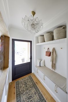 Mudroom drop zone in Hamptons style home Sculptural Lamp, Front Hallway, Statement Chandelier, Loft Storage, Hall Runner, Beacon Lighting